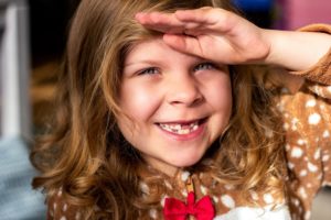  girl with missing tooth for tooth fairy